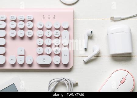 Composition with different modern gadgets on white wooden background, closeup Stock Photo
