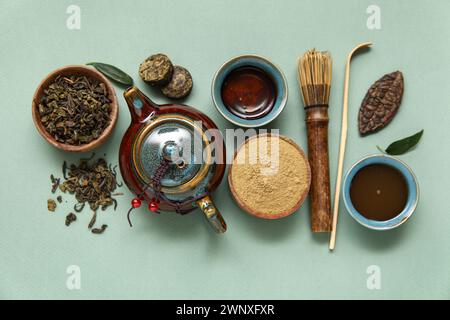 Composition with matcha tea and accessories on olive background Stock Photo