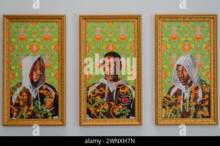 Paintings by artist Kehinde Wiley in Rubell museum of contemporary arts in Miami, Florida. Trio of Charles. Stock Photo