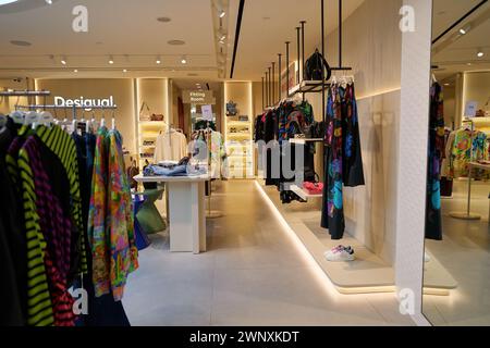 SINGAPORE - NOVEMBER 06, 2023: various apparel displayed at Desigual store. Desigual is a Spanish fashion label. Stock Photo