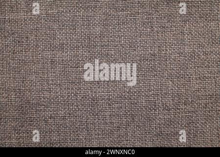 Natural linen material textile canvas Fabric texture background Close-up detail of fabric natural color Hemp material pattern design wallpaper. Stock Photo