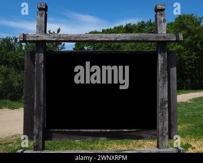 Blank black horizontal rectangular pylon stand on forest dirt road mock up. Empty panel for advertisement, promotion mockup. Clear canvas frame banner Stock Photo