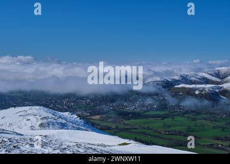 Inversion mist above Church Stretton, with snow on the Long Mynd, seen from a snowy Caer Caradoc, Church Stretton, Shropshire Stock Photo