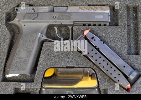 Modern semi-automatic pistol without magazine in a gun bag at an event promoting the military held for civilians Stock Photo