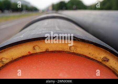 Steel pipe with heat insulation on construction site close up Stock Photo