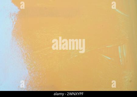 Orange white oil painting on plastered wall. Oil paint texture with brush and palette knife strokes. Modern art concept. Horizontal fragment. Stock Photo