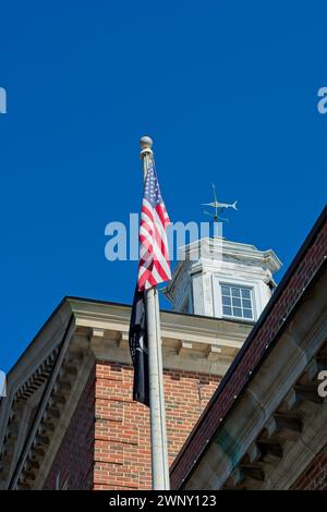 Swordfish wind vane sets on top of cupola on roof of 1930 brick post office building on Commercial Street, Provincetown Stock Photo