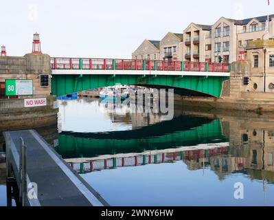 Weymouth Town Bridge over the river Wey at Weymouth Harbour in Dorset, England. The bridge is a lifting bascule type. Stock Photo