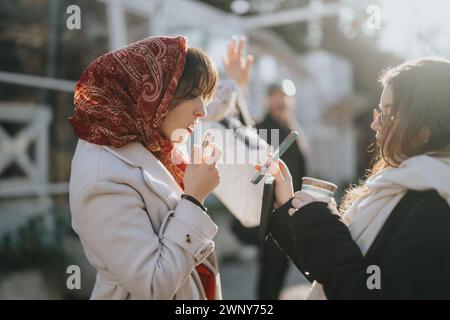 Multicultural young entrepreneurs engaged in a passionate business discussion outdoors, strategizing for success with a cityscape backdrop. Stock Photo
