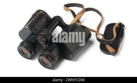 set of old classic black binoculars with metal housing and anti-reflective coating on the lenses used for activities such as birdwatching, hunting Stock Photo