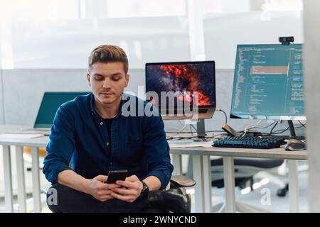 Programming. Man Working On Computer In IT Office, Sitting At Desk Writing Codes. Programmer Typing Data Code, Working On Project In Software Stock Photo