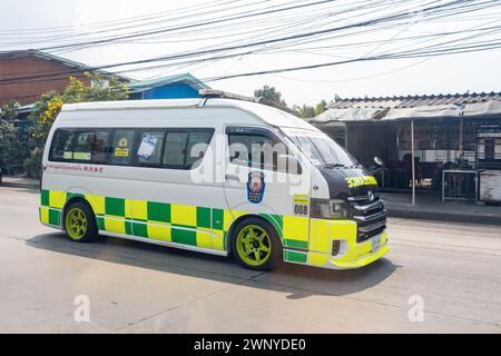 SAMUT PRAKAN, THAILAND, FEB 26 2024, An ambulance is driving down the street Stock Photo