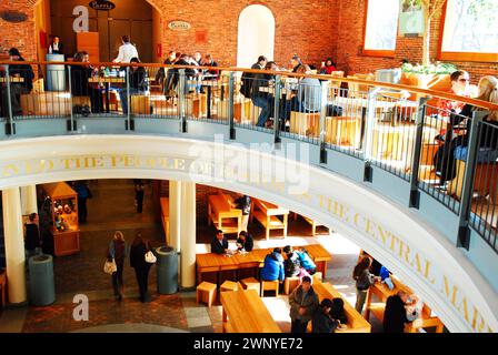 A lunch time crowd gathers at the food court in Quincy Market in Boston Stock Photo