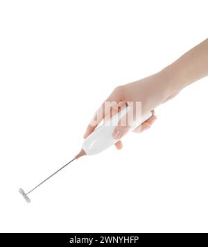 Woman holding milk frother wand on white background, closeup Stock Photo