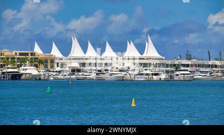 Surfers Paradise, Queensland, Australia - 16 February 2021: Serene ocean view dotted with high-end boats at a coastal marina on the Gold Coast in Aust Stock Photo