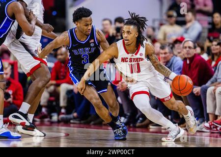 Raleigh, NC, USA. 04th Mar, 2024. North Carolina State Wolfpack guard Breon Pass (10) drives around Duke Blue Devils guard Jeremy Roach (3) during the second half of the ACC Basketball matchup at PNC Arena in Raleigh, NC. (Scott Kinser/CSM). Credit: csm/Alamy Live News Stock Photo