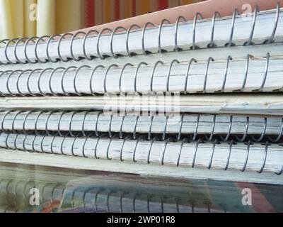 A stack of spring notebooks. Thick notebooks or notebooks placed on top ...