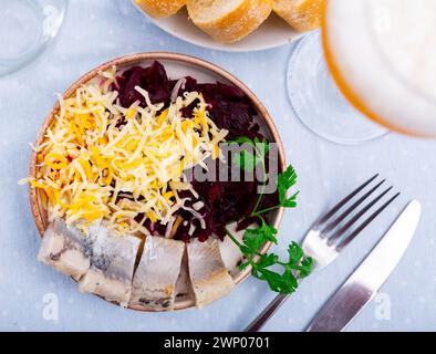 Beetroot served with cheese and pickled mackerel Stock Photo