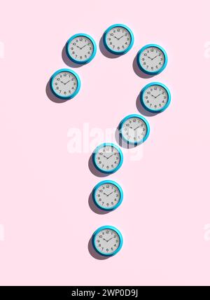 Wall clocks designed as question mark symbol on pink background. Project time management, deadline or question of time concepts. 3D render. Stock Photo