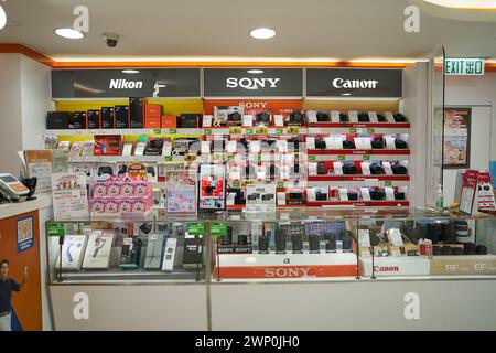 HONG KONG, CHINA - DECEMBER 04, 2023: various digital cameras for sale at Fortress consumer electronics store in New Town Plaza shopping mall. Stock Photo