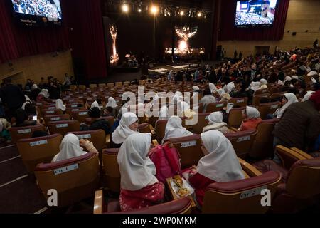 Tehran, Iran. 04th Mar, 2024. Iranian singer Reza Sadeghi (C) is ...