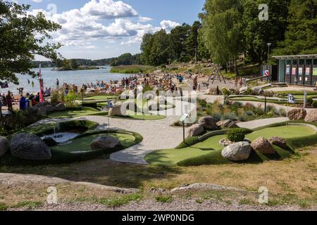 Trosa, Sweden - July 29, 2023: People relax on the beach at Trosa Havsbad in the Södermanland area, surrounded by magnificent archipelago views Stock Photo