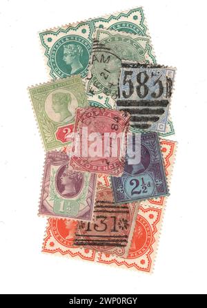 A montage of vintage Queen Victoria postage stamps from Great Britain isolated on a white background. Stock Photo