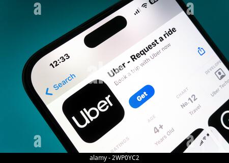 Nanning, China - Feb 22, 2024. Uber app on a smartphone. Uber is a taxi like technology company. Stock Photo