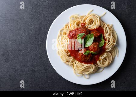 Spaghetti with meatballs on black background Stock Photo