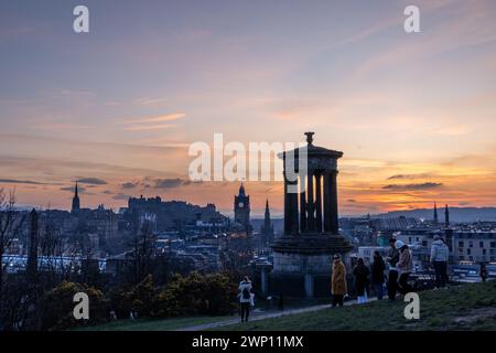 Edinburgh, United Kingdom. 04 March, 2024 Pictured: Tourists gather on Edinburgh’s Calton Hill to watch the sunset over the city. Credit: Rich Dyson Stock Photo