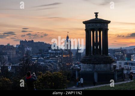Edinburgh, United Kingdom. 04 March, 2024 Pictured: Tourists gather on Edinburgh’s Calton Hill to watch the sunset over the city. Credit: Rich Dyson Stock Photo