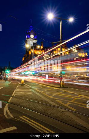 Edinburgh, United Kingdom. 04 March, 2024 Pictured: The light trails of vehicles driving along Edinburgh’s Princes Street in front on the Rocco Forte Stock Photo