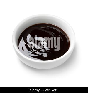 Single white bowl with oyster sauce isolated on white background close up Stock Photo