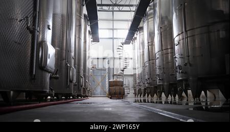 Modern winery interior with large metal tanks Stock Photo