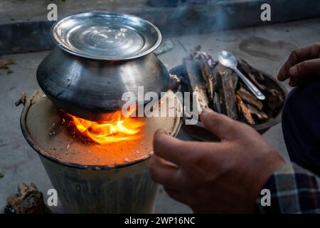 March 3rd 2024, Uttarakhand India. Angeethi Cooking: Outdoor clay stove with firewood in rural Uttarakhand village, India. Stock Photo