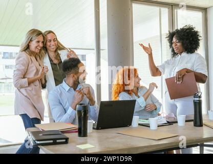 Business team happy and smiling after finishing a work project. Business concept. Stock Photo