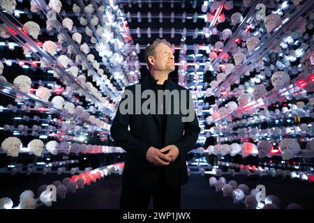 Artist Nathan Sawaya looks at Lego sculls during the preview for the Art of the Brick Lego exhibition at the Boiler House in east London. Picture date: Tuesday March 5, 2024. Stock Photo