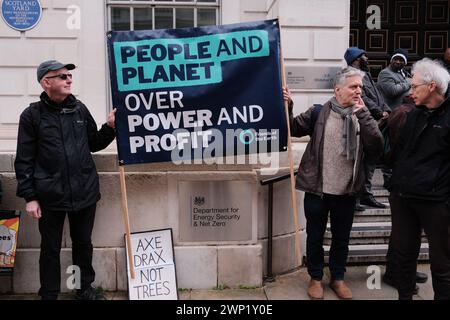 London, UK. 5th Mar, 2024. Activists from various environmental groups gather at the Department for Energy, Security and Net Zero to protest against the potential increase in subsidies for the Drax and Lynemouth power stations, advocating for the preservation of forests and a reduction in pollution. The groups include Extinction Rebellion, Biofuelwatch, Stop Burning Trees Coalition, Fossil Free London, Greenpeace, Stop Rosebank, Campaign Against Climate Change. Credit: Joao Daniel Pereira/Alamy Live News Stock Photo