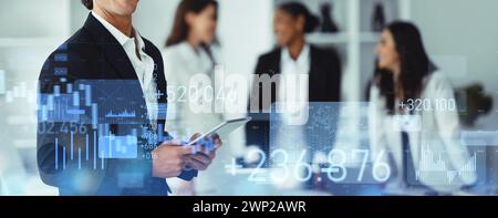 Focused businessman using tablet with futuristic digital financial graphs and world data analysis Stock Photo
