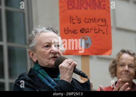 London, UK. 5th Mar, 2024. Green Party peer Jenny Jones, Baroness Jones of Moulsecoomb, addresses environmental activists protesting outside the Department for Energy Security and Net Zero (DESNZ) against government plans to provide further public subsidies to tree-burning power plants Drax, in Yorkshire, and Lynemouth in Northumberland. Credit: Ron Fassbender/Alamy Live News Stock Photo