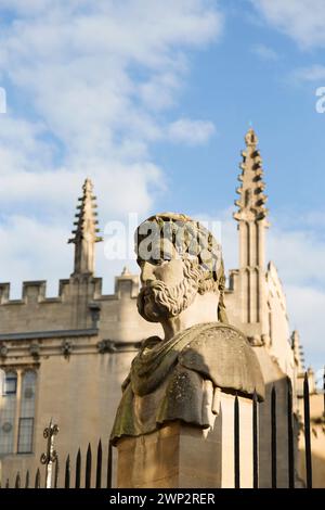 UK, Oxford, Emperor Heads, Stonework on Wren's Sheldonian Theatre. Stock Photo