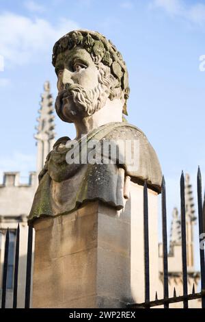 UK, Oxford, Emperor Heads, Stonework on Wren's Sheldonian Theatre. Stock Photo