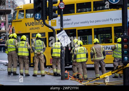 Aftermath of a double-decker bus crash which took place on New Oxford Street on 5th March 2024 in London, United Kingdom. Emergency services cordoned off the area following the accident in which a yellow Routemaster bus crashed into an empty building which was under redevelopment. No one has been reported as being seriously injured although one person was taken away for treatment. Stock Photo