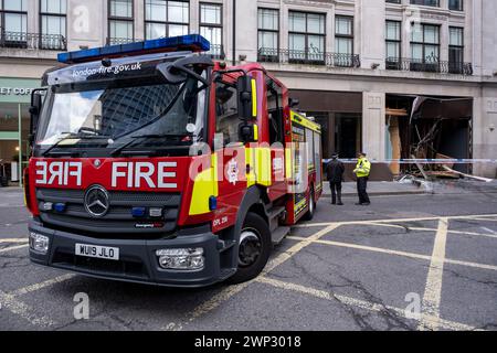 Aftermath of a double-decker bus crash which took place on New Oxford Street on 5th March 2024 in London, United Kingdom. Emergency services cordoned off the area following the accident in which a yellow Routemaster bus crashed into an empty building which was under redevelopment. No one has been reported as being seriously injured although one person was taken away for treatment. Stock Photo