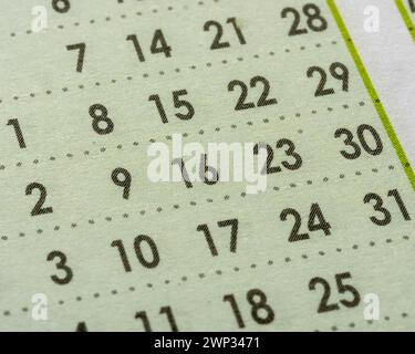 Month date numbers on planner. Close up of calendar page Stock Photo