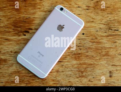 A well used iPhone 6s smartphone launched in 2015 and the first to offer a rose gold colour option Stock Photo