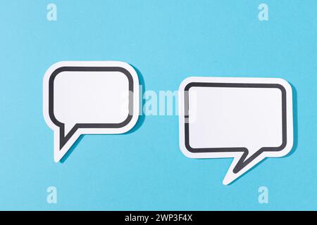 Two Blank Speech Bubble isolated on blue background. Mock up template Stock Photo