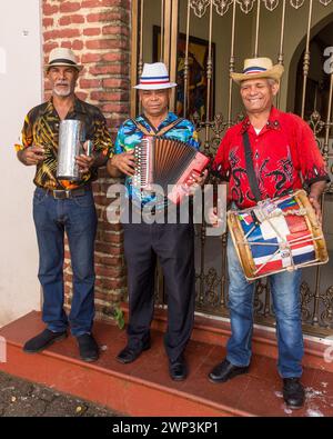 A Dominican merengue band plays in the Colonial City of Santo Domingo, Dominican Republic.  Merengue tipico or folk music is traditionally played on t Stock Photo