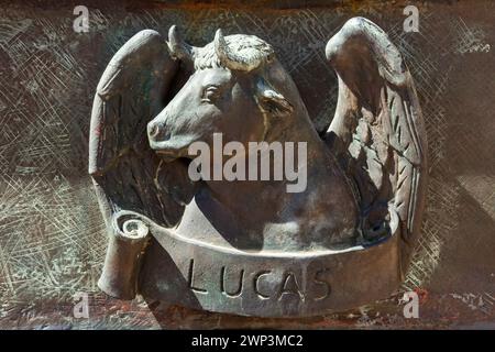 Bronze bust of a bull, representing St. Luke, on the gate of the Cathedral of Santo Domingo, Dominican Republic.  The Cathedral of Santa Maria La Meno Stock Photo