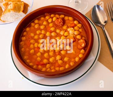 Garbanzos a la riojana, a spanish chickpeas stew with ham Stock Photo